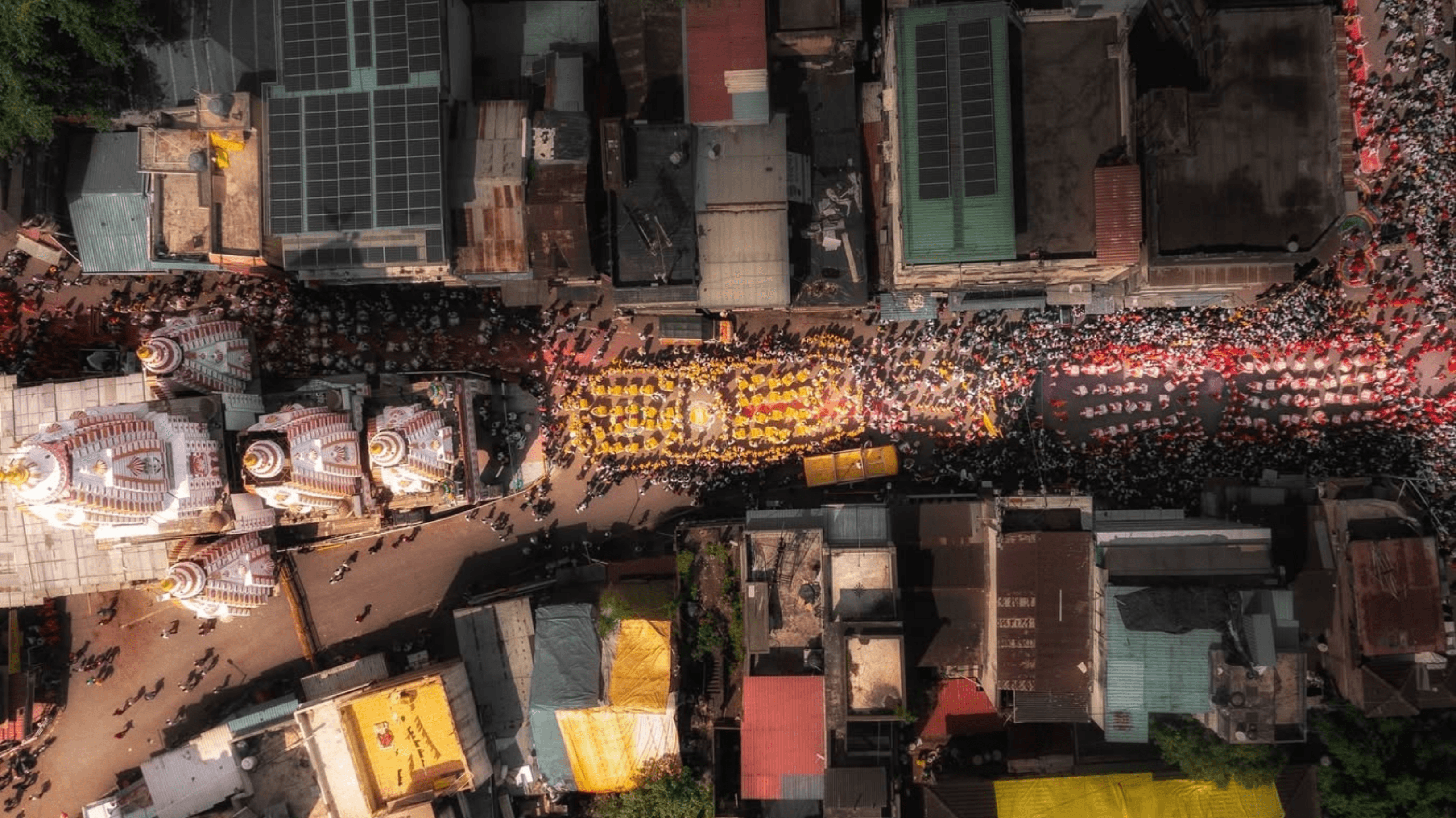 A grand procession with the pathak in traditional white attire